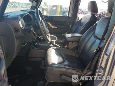 Zdjęcie 7 z 14 samochodu: 2016 JEEP WRANGLER UNLIMITED SAHARA VIN:1C4HJWEG2GL178624 - miniatura