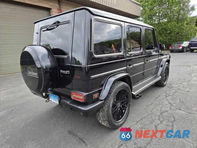 Czwarte zdjęcie samochodu z boku: 2005 MERCEDES-BENZ G 500 VIN:WDCYR49E85X158464 - miniatura