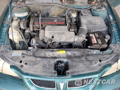 Zdjęcie 11 z 13 samochodu: 1999 PONTIAC GRAND AM SE VIN:1G2NE52T0XM701933 - miniatura