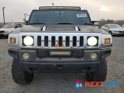 Piąte zdjęcie samochodu w środku: 2003 HUMMER H2 VIN:5GRGN23U03H137888 - miniatura