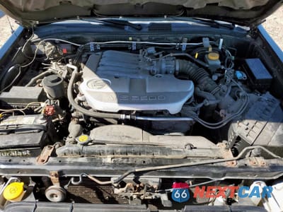 Zdjęcie 12 z 13 samochodu: 2003 NISSAN PATHFINDER LE VIN:JN8DR09Y03W825591 - miniatura