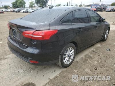 Trzecie zdjęcie samochodu z tyłu: 2016 FORD FOCUS SE VIN:1FADP3F29GL387931 - miniatura