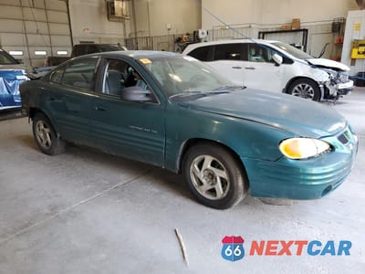 Czwarte zdjęcie samochodu z boku: 1999 PONTIAC GRAND AM SE VIN:1G2NE52T0XM701933 - miniatura