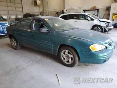 Czwarte zdjęcie samochodu z boku: 1999 PONTIAC GRAND AM SE VIN:1G2NE52T0XM701933 - miniatura