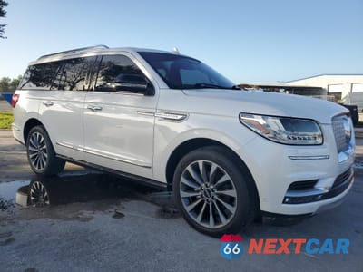 Czwarte zdjęcie samochodu z boku: 2018 LINCOLN NAVIGATOR SELECT VIN:5LMJJ2HT7JEL21199 - miniatura