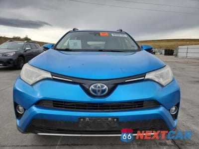 Piąte zdjęcie samochodu w środku: 2018 TOYOTA RAV4 HV VIN:JTMRJREV2JD187989 - miniatura