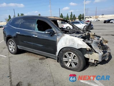 Czwarte zdjęcie samochodu z boku: 2016 CHEVROLET TRAVERSE LT VIN:1GNKRHKD2GJ164357 - miniatura