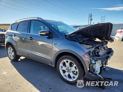 Czwarte zdjęcie samochodu z boku: 2016 FORD ESCAPE TITANIUM VIN:1FMCU9J91GUC42989 - miniatura