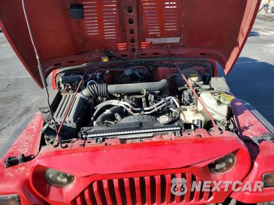 Zdjęcie 12 z 15 samochodu: 2000 JEEP WRANGLER / TJ SPORT VIN:1J4FA49S9YP760265 - miniatura