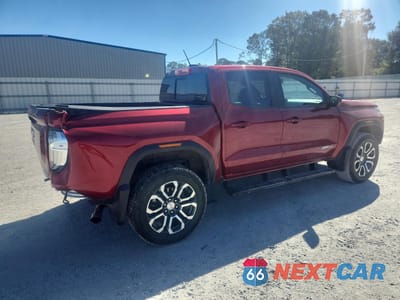 Trzecie zdjęcie samochodu z tyłu: 2023 GMC CANYON AT4 VIN:1GTP6DEK4P1253048 - miniatura