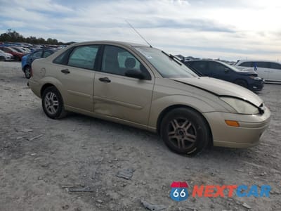 Czwarte zdjęcie samochodu z boku: 2002 FORD FOCUS SE VIN:1FAFP34P22W261327 - miniatura