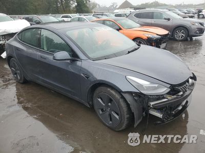Czwarte zdjęcie samochodu z boku: 2023 TESLA MODEL 3 VIN:5YJ3E1EA2PF700054 - miniatura