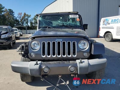 Piąte zdjęcie samochodu w środku: 2016 JEEP WRANGLER UNLIMITED SAHARA VIN:1C4BJWEG3GL268452 - miniatura