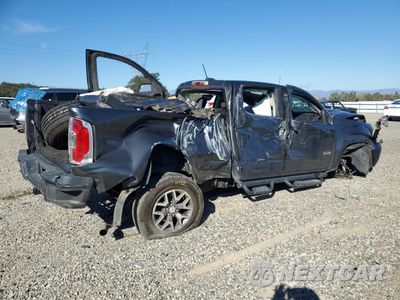 Trzecie zdjęcie samochodu z tyłu: 2016 GMC CANYON SLE VIN:1GTG5CE32G1247450 - miniatura