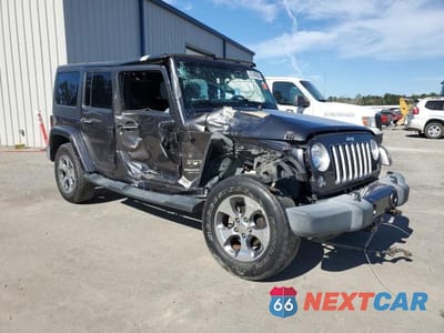 Czwarte zdjęcie samochodu z boku: 2016 JEEP WRANGLER UNLIMITED SAHARA VIN:1C4BJWEG3GL268452 - miniatura