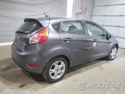 Trzecie zdjęcie samochodu z tyłu: 2015 FORD FIESTA SE VIN:3FADP4EJXFM118509 - miniatura