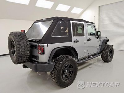 Trzecie zdjęcie samochodu z tyłu: 2015 JEEP WRANGLER UNLIMITED SPORT VIN:1C4BJWDG5FL571975 - miniatura