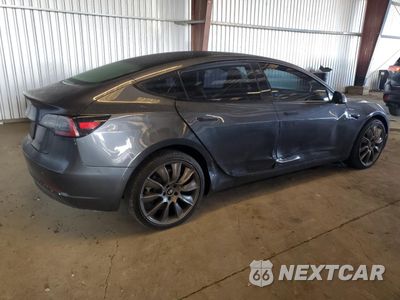 Trzecie zdjęcie samochodu z tyłu: 2021 TESLA MODEL 3 VIN:5YJ3E1EB0MF050967 - miniatura
