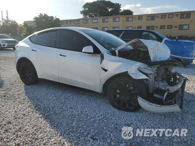 Czwarte zdjęcie samochodu z boku: 2023 TESLA MODEL Y VIN:7SAYGDEE6PA027192 - miniatura