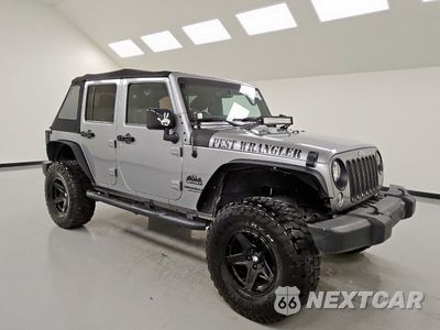Czwarte zdjęcie samochodu z boku: 2015 JEEP WRANGLER UNLIMITED SPORT VIN:1C4BJWDG5FL571975 - miniatura