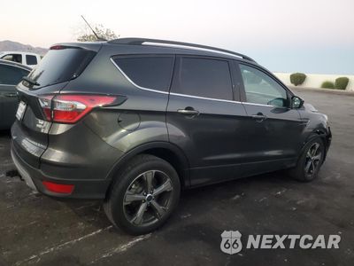Trzecie zdjęcie samochodu z tyłu: 2017 FORD ESCAPE SE VIN:1FMCU9G9XHUB01640 - miniatura