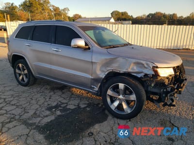 Czwarte zdjęcie samochodu z boku: 2015 JEEP GRAND CHEROKEE OVERLAND VIN:1C4RJECT4FC734753 - miniatura