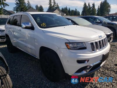 Czwarte zdjęcie samochodu z boku: 2014 JEEP GRAND CHEROKEE SUMMIT VIN:1C4RJFJT4EC178080 - miniatura