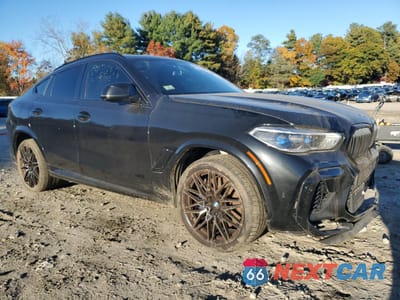 Czwarte zdjęcie samochodu z boku: 2020 BMW X6 M VIN:5YMCY0C02L9C65644 - miniatura