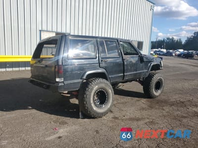 Trzecie zdjęcie samochodu z tyłu: 1999 JEEP CHEROKEE SE VIN:1J4FT28P3XL595475 - miniatura