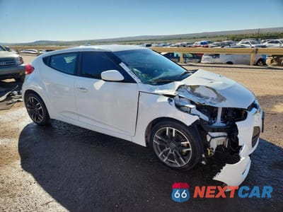 Czwarte zdjęcie samochodu z boku: 2014 HYUNDAI VELOSTER BASE VIN:KMHTC6AD7EU190996 - miniatura