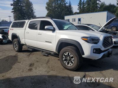 Czwarte zdjęcie samochodu z boku: 2023 TOYOTA TACOMA DOUBLE CAB VIN:3TMDZ5BN7PM143824 - miniatura