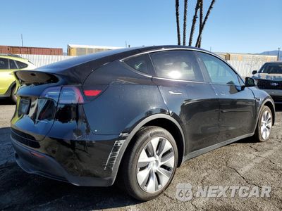 Trzecie zdjęcie samochodu z tyłu: 2023 TESLA MODEL Y VIN:7SAYGAEE4PF902660 - miniatura