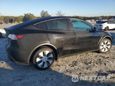 Trzecie zdjęcie samochodu z tyłu: 2023 TESLA MODEL Y VIN:7SAYGDEE9PA144264 - miniatura