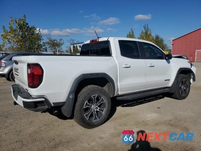 Trzecie zdjęcie samochodu z tyłu: 2023 GMC CANYON AT4 VIN:1GTP6DEK5P1241393 - miniatura