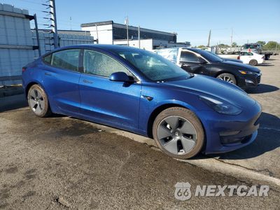 Czwarte zdjęcie samochodu z boku: 2022 TESLA MODEL 3 VIN:5YJ3E1EA5NF371010 - miniatura