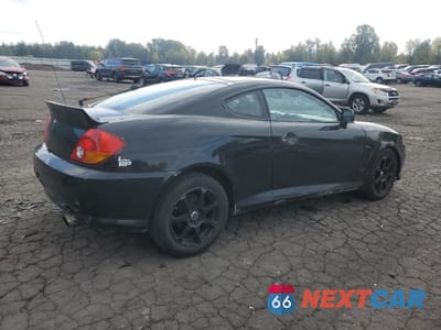 Trzecie zdjęcie samochodu z tyłu: 2003 HYUNDAI TIBURON VIN:KMHHN65F13U077098 - miniatura