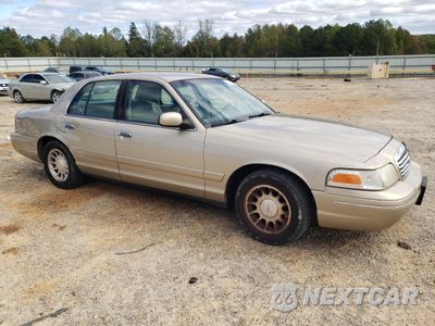 Czwarte zdjęcie samochodu z boku: 1999 FORD CROWN VICTORIA LX VIN:2FAFP74W1XX143070 - miniatura