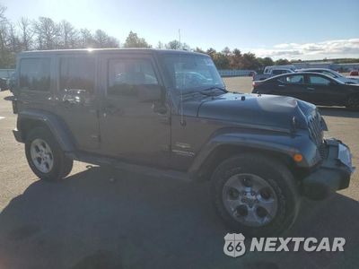 Czwarte zdjęcie samochodu z boku: 2014 JEEP WRANGLER UNLIMITED SAHARA VIN:1C4HJWEG7EL240354 - miniatura