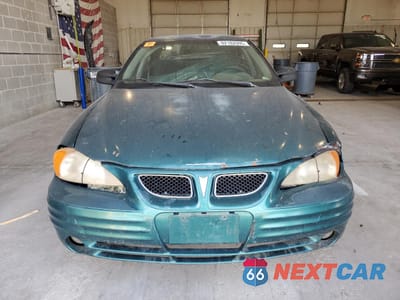 Piąte zdjęcie samochodu w środku: 1999 PONTIAC GRAND AM SE VIN:1G2NE52T0XM701933 - miniatura