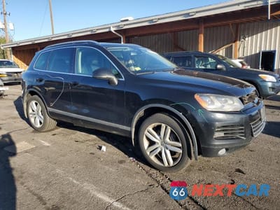 Czwarte zdjęcie samochodu z boku: 2014 VOLKSWAGEN TOUAREG V6 TDI VIN:WVGEP9BP9ED008934 - miniatura