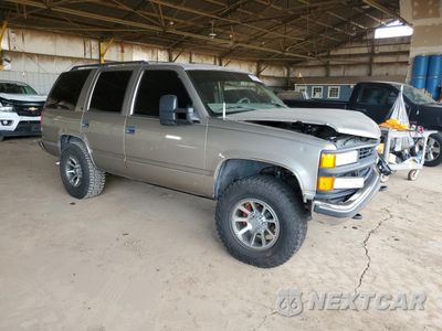 Czwarte zdjęcie samochodu z boku: 1999 CHEVROLET TAHOE K1500 VIN:1GNEK13R9XJ457367 - miniatura
