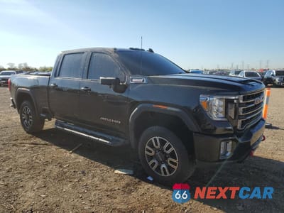 Czwarte zdjęcie samochodu z boku: 2022 GMC SIERRA K2500 AT4 VIN:1GT49PEY5NF172978 - miniatura