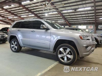Czwarte zdjęcie samochodu z boku: 2014 JEEP GRAND CHEROKEE OVERLAND VIN:1C4RJFCG2EC279277 - miniatura