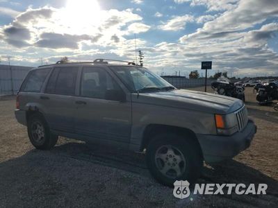 Czwarte zdjęcie samochodu z boku: 1997 JEEP GRAND CHEROKEE LAREDO VIN:1J4GZ58S9VC673117 - miniatura
