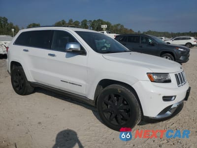 Czwarte zdjęcie samochodu z boku: 2014 JEEP GRAND CHEROKEE SUMMIT VIN:1C4RJFJT8EC346884 - miniatura