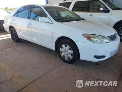 Czwarte zdjęcie samochodu z boku: 2002 TOYOTA CAMRY VIN:JTDBE32K520134404 - miniatura