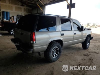 Trzecie zdjęcie samochodu z tyłu: 1999 CHEVROLET TAHOE K1500 VIN:1GNEK13R9XJ457367 - miniatura