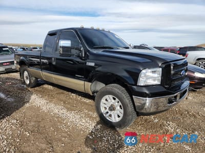 Czwarte zdjęcie samochodu z boku: 2001 FORD F250 SUPER DUTY VIN:1FTNX21FX1ED21404 - miniatura