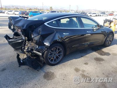 Trzecie zdjęcie samochodu z tyłu: 2020 TESLA MODEL 3 VIN:5YJ3E1EA3LF606484 - miniatura