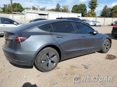 Trzecie zdjęcie samochodu z tyłu: 2023 TESLA MODEL 3 VIN:5YJ3E1EA3PF699402 - miniatura